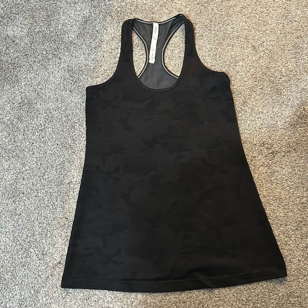 Women’s  Lululemon racerback tank in a black camouflage print. Size 10.
